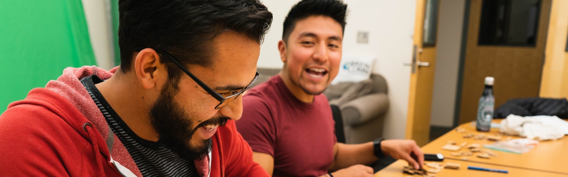 Two students designing an educational game on paper